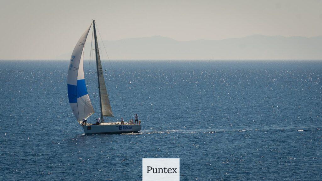 White and Blue Sailboat on Sea